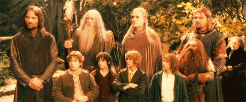 A Group Of Men Are Standing Next To Each Other In A Line . GIF