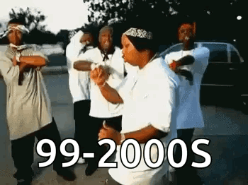A Group Of Men Are Standing Next To Each Other In A Parking Lot . GIF