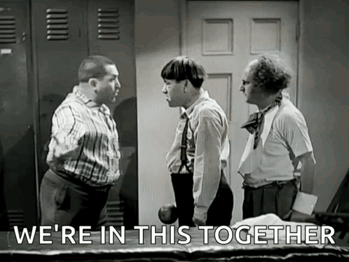 A Group Of Men Are Standing Next To Each Other In A Room And Talking . GIF