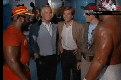 A Group Of Men Are Standing Next To Each Other In A Room And Talking To Each Other GIF