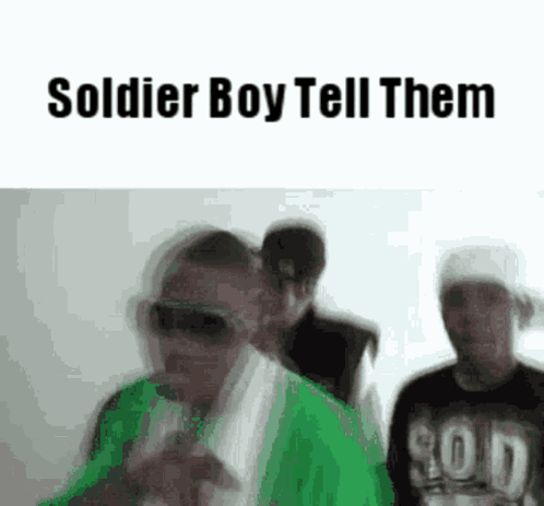 A Group Of Men Are Standing Next To Each Other In A Room . GIF