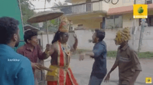 a group of men are standing next to each other on a street .