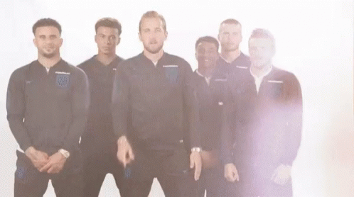 A Group Of Men Are Standing Next To Each Other On A White Background And Making Funny Faces . GIF