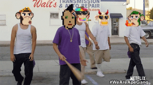 A Group Of Men Are Walking Down A Street In Front Of A Walt 'S Transmission & Auto Repair Shop GIF