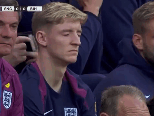 A Group Of Men Are Watching A Soccer Game Between England And Bih GIF