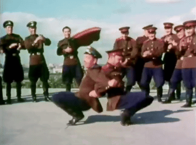 Men In Military Uniforms Dancing On Rooftop GIF