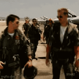 A Group Of Men In Military Uniforms Are Walking On A Runway .. GIF