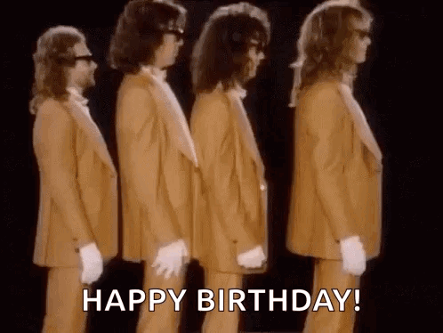 A Group Of Men In Suits And Gloves Are Standing Next To Each Other In A Line . GIF