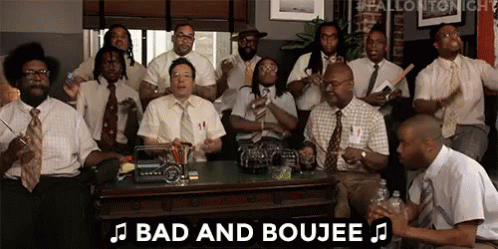 A Group Of Men In Suits And Ties Are Sitting Around A Table And Playing Instruments . GIF