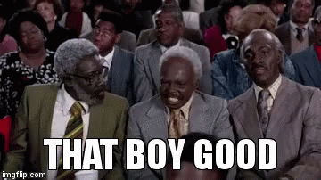 A Group Of Men In Suits And Ties Are Sitting In A Theatre . GIF