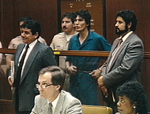 A Group Of Men In Suits And Ties Are Standing In A Room With The Number 11 On The Door GIF