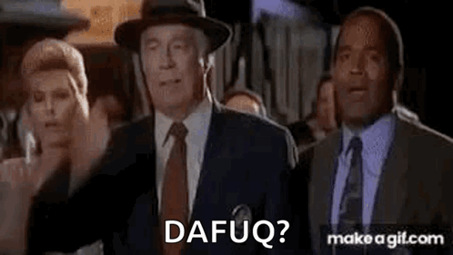 A Group Of Men In Suits And Ties Are Standing Next To Each Other And One Of Them Is Wearing A Hat . GIF