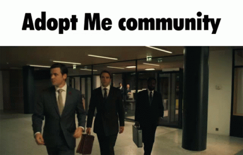 A Group Of Men In Suits And Ties Are Walking Down A Hallway With Adopt Me Community Written Above Them GIF