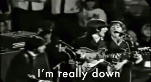 A Group Of Men Singing And Playing Guitars With The Words " I 'M Really Down " Above Them GIF