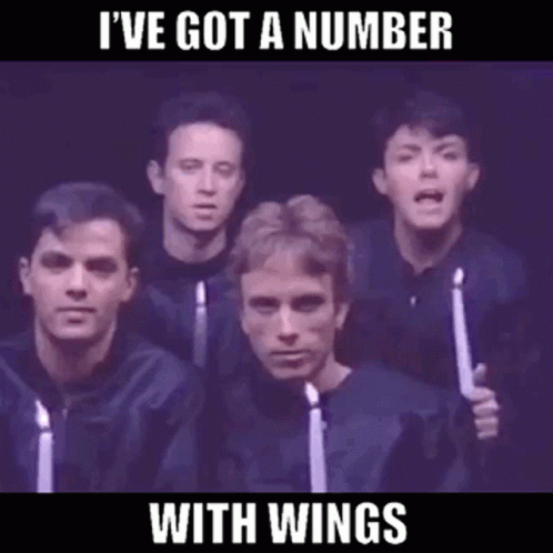 A Group Of Men Singing In A Choir With Candles In Their Hands GIF