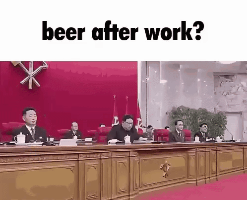 A Group Of Men Sitting At A Table With The Words Beer After Work GIF