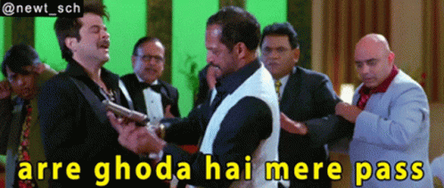 A Group Of Men Standing Around A Man Holding A Gun With The Caption Arre Ghoda Hai Mere Pass GIF