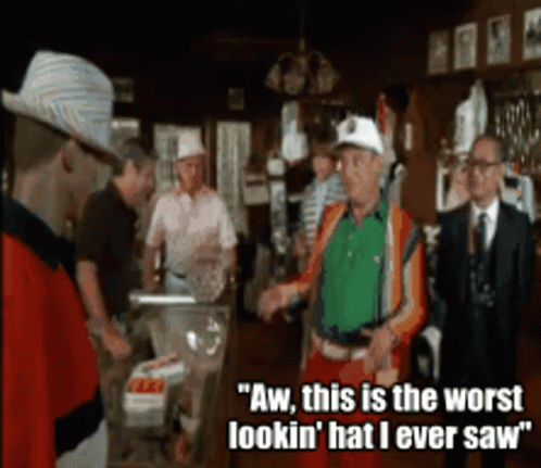 A Group Of Men Standing In A Room With One Saying Aw This Is The Worst Lookin ' Hat I Ever Saw ' GIF