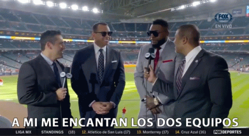 a group of men standing in front of a fox sports broadcast