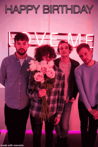 A Group Of Men Standing In Front Of A Love Me Sign GIF