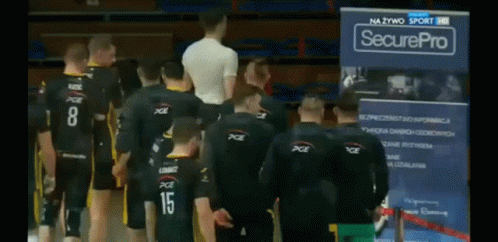 A Group Of Men Standing In Front Of A Securepro Banner GIF