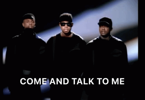 A Group Of Men Standing Next To Each Other With The Words Come And Talk To Me Above Them GIF