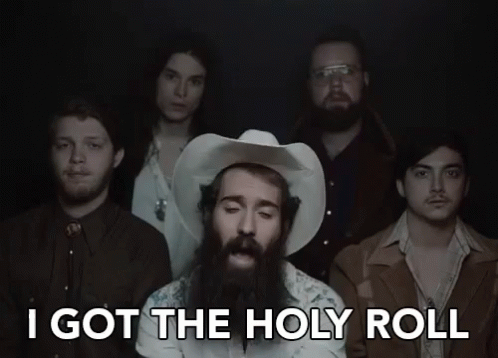 A Group Of Men Standing Next To Each Other With The Words I Got The Holy Roll GIF