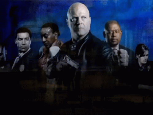 A Group Of Men Standing Next To Each Other With The Words " The Shield " On The Bottom GIF