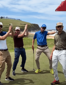 A Group Of Men Standing On A Golf Course With One Wearing A Blue Shirt That Says ' Taylormade ' On It GIF