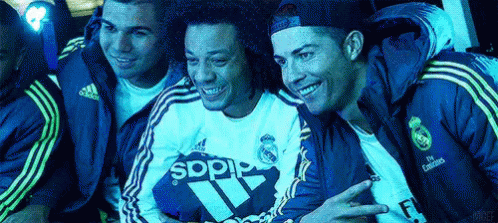 a group of men wearing adidas jackets are posing for a picture together