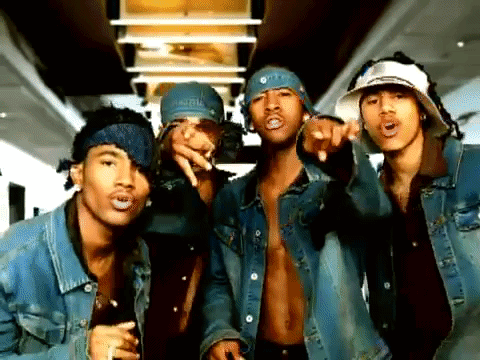 A Group Of Men Wearing Denim Jackets And Bandanas Pointing At The Camera GIF