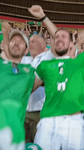 A Group Of Men Wearing Green Jerseys With The Number 3 On Them GIF