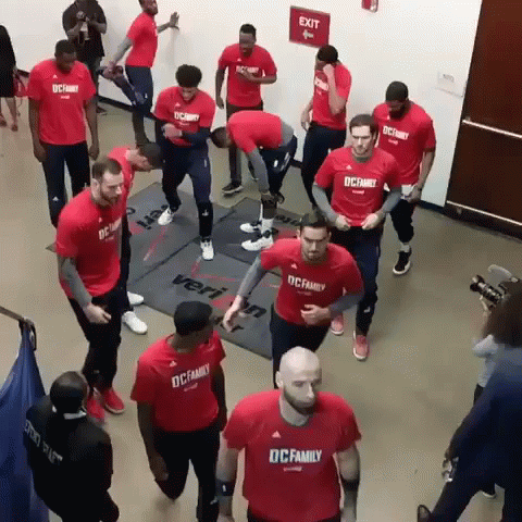a group of men wearing red shirts that say dc family on them