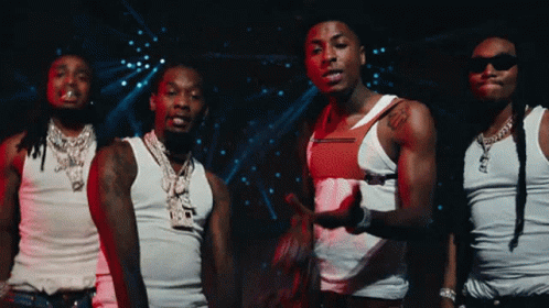 A Group Of Men Wearing White Tank Tops And Sunglasses GIF