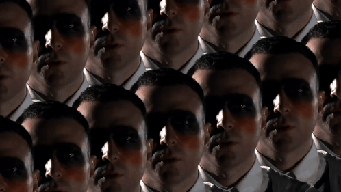 A Group Of Men With Their Faces Painted Black GIF