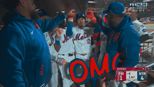A Group Of Mets Baseball Players Holding A Sign That Says " Omg " GIF