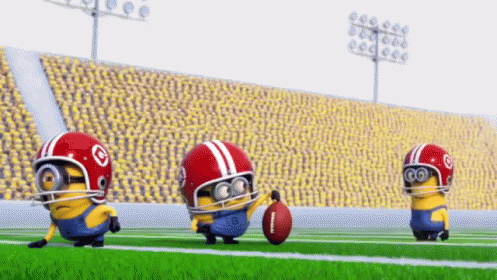 A Group Of Minions Are Playing Football On A Field GIF