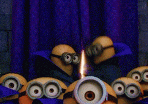 A Group Of Minions Are Standing In Front Of A Purple Curtain GIF