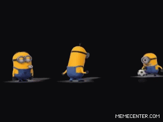A Group Of Minions Are Standing Next To A Soccer Ball GIF