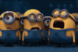 A Group Of Minions Are Standing Next To Each Other With Their Mouths Open GIF