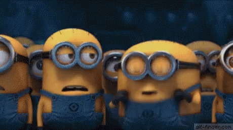 A Group Of Minions Are Standing Next To Each Other With Their Mouths Wide Open . GIF