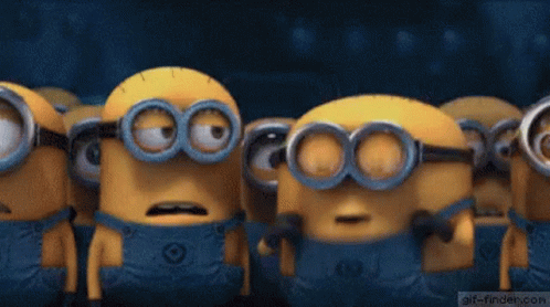 A Group Of Minions Are Standing Next To Each Other With Their Mouths Wide Open . GIF