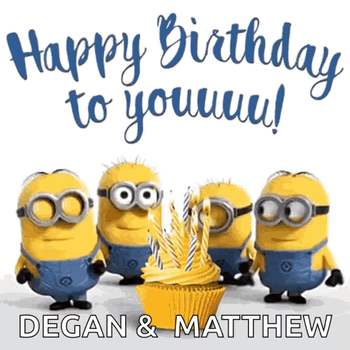 A Group Of Minions Standing Around A Cupcake With Candles On It GIF