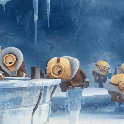 A Group Of Minions Standing In A Cave With Icicles Hanging From The Ceiling GIF