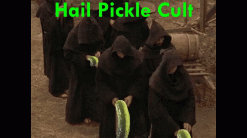 A Group Of Monks Are Holding Pickles In Front Of A Sign That Says " Hail Pickle Cult " GIF