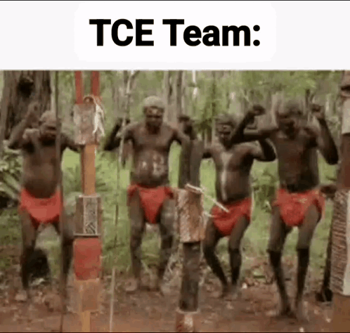 A Group Of Native Americans Are Dancing In A Forest . GIF