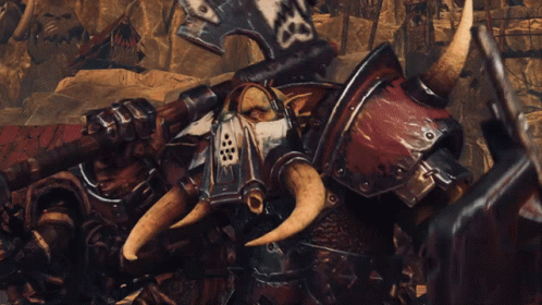 A Group Of Orcs Are Standing In A Desert Holding Weapons And A Shield GIF