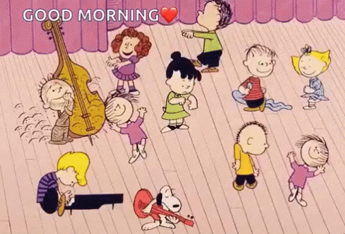 A Group Of Peanuts Characters Are Dancing On A Stage With The Words Good Morning Written Above Them GIF