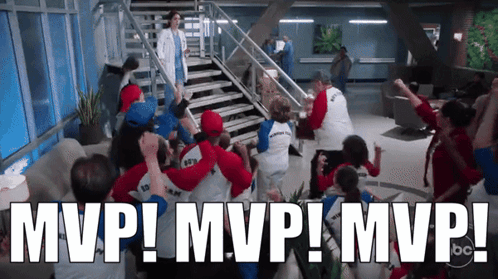 A Group Of People Are Celebrating With The Words Mvp ! Mvp ! Mvp ! Written Above Them GIF