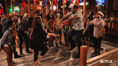 A Group Of People Are Dancing In A Bar With A Netflix Logo In The Corner GIF